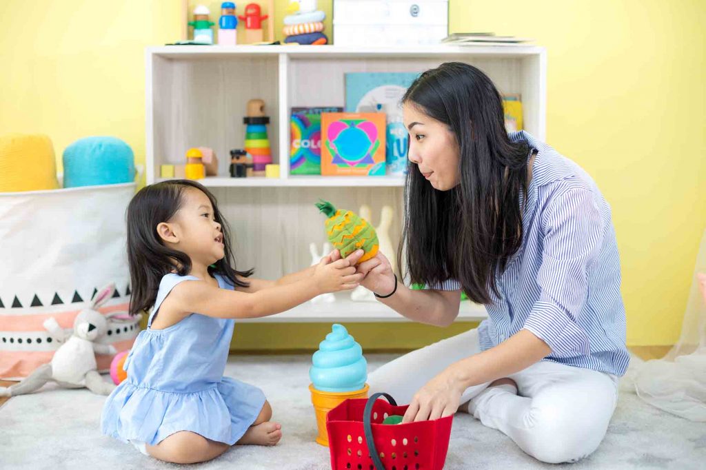 Asian,Mother,And,Daughter,Playing,Toy,In,House